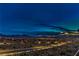 The city lights shine in the distance, providing a beautiful view from this elevated desert location at 2747 White Sage Dr, Henderson, NV 89052