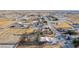 Aerial view of the desert home, set on a dirt lot in an expansive residential neighborhood at 3051 S Rainbow Ave, Pahrump, NV 89048