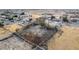 Suburban residential lot featuring a home, fenced yard, mature trees and desert landscaping at 3051 S Rainbow Ave, Pahrump, NV 89048