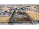 Residential lot with a house, fenced yard, mature trees and desert landscaping at 3051 S Rainbow Ave, Pahrump, NV 89048
