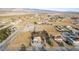 Expansive aerial view of a desert home surrounded by desert landscape, with a backdrop of the mountains at 3051 S Rainbow Ave, Pahrump, NV 89048