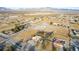 Expansive aerial view of the desert home surrounded by desert landscape, in a desert community at 3051 S Rainbow Ave, Pahrump, NV 89048