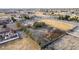 Residential lot with a house, RV, partially fenced yard, mature trees and desert landscaping at 3051 S Rainbow Ave, Pahrump, NV 89048