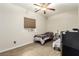 Bright bedroom features two twin beds, neutral paint, and wood-look flooring at 3051 S Rainbow Ave, Pahrump, NV 89048