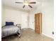This neutral bedroom features wood-look flooring and a natural wood wardrobe at 3051 S Rainbow Ave, Pahrump, NV 89048