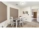 Dining room with seating for four and modern lighting at 3051 S Rainbow Ave, Pahrump, NV 89048