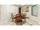 Dining room featuring a round glass table, traditional chairs, and neutral decor at 3051 S Rainbow Ave, Pahrump, NV 89048