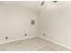Unfurnished room featuring tile flooring, a ceiling fan and light, and freshly painted neutral walls at 3051 S Rainbow Ave, Pahrump, NV 89048