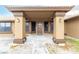Inviting entrance with a tiled walkway, covered porch, and stylish exterior lighting at 3051 S Rainbow Ave, Pahrump, NV 89048