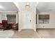 Bright entryway showcasing new floors, neutral walls and a glimpse into adjacent rooms at 3051 S Rainbow Ave, Pahrump, NV 89048