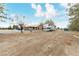 Exterior of property with view of multiple vehicles parked on the property at 3051 S Rainbow Ave, Pahrump, NV 89048