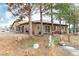 Single story home with a neutral color palette and beautiful surrounding mature trees at 3051 S Rainbow Ave, Pahrump, NV 89048