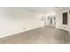 Large living area showcasing neutral decor, lots of natural light, and durable floors at 3051 S Rainbow Ave, Pahrump, NV 89048