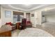 Inviting office space with hardwood floors, natural light, a wooden desk and furniture, and a neutral color palette at 3051 S Rainbow Ave, Pahrump, NV 89048
