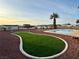 Expansive backyard with a putting green, desert landscaping, and community views at 308 Cannes St, Henderson, NV 89015