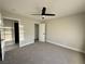 Bright bedroom with ceiling fan, offering ample space and convenient access to closet and bathroom at 308 Cannes St, Henderson, NV 89015