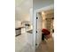 Hallway with barn door leading to a bathroom and an adjacent sitting area at 308 Cannes St, Henderson, NV 89015
