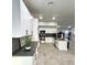 Spacious kitchen with modern appliances, gray countertops, and sleek white cabinetry at 308 Cannes St, Henderson, NV 89015