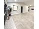 Bright living room with tiled floors, recessed lights, and a fireplace with mantle at 308 Cannes St, Henderson, NV 89015