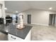 Open living room with tiled floors and views into other rooms at 308 Cannes St, Henderson, NV 89015