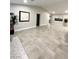 Open living room with tiled floors and views into other rooms at 308 Cannes St, Henderson, NV 89015