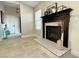 Living Room featuring a stylish fireplace, tiled floors, and a neutral paint palette at 308 Cannes St, Henderson, NV 89015