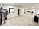 Spacious living room with tiled floors, recessed lights, and neutral paint palette at 308 Cannes St, Henderson, NV 89015