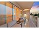 Relaxing balcony area with comfortable seating and sliding glass doors at 3111 Bel Air Dr # 7D, Las Vegas, NV 89109