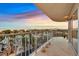 Spacious balcony with panoramic city views at sunset, featuring tile flooring at 3111 Bel Air Dr # 7D, Las Vegas, NV 89109