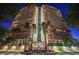 Exterior view of high-rise building featuring balconies and palm trees at 3111 Bel Air Dr # 7D, Las Vegas, NV 89109