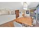 Inviting dining room features hardwood floors, stylish lighting, and sliding glass doors to the outdoor area at 3111 Bel Air Dr # 7D, Las Vegas, NV 89109