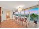 Elegant dining room with hardwood floors and panoramic views through large windows at 3111 Bel Air Dr # 7D, Las Vegas, NV 89109