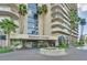 Daytime view of the Regency Towers entrance, featuring a well-maintained circular garden at 3111 Bel Air Dr # 7D, Las Vegas, NV 89109