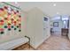 Stylish hallway with hardwood floors, modern art and access to multiple rooms at 3111 Bel Air Dr # 7D, Las Vegas, NV 89109
