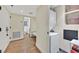 Functional hallway including a laundry area, storage and a doorway to the bathroom at 3111 Bel Air Dr # 7D, Las Vegas, NV 89109