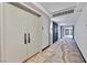 Condo hallway features a patterned carpet with dual entry doors and recessed lighting at 3111 Bel Air Dr # 7D, Las Vegas, NV 89109