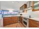 Updated kitchen features wood cabinets, stainless steel appliances, a wine cooler, an island sink, and a scenic backdrop at 3111 Bel Air Dr # 7D, Las Vegas, NV 89109