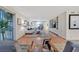 Open living room with custom built-ins, hardwood floors, and sliding glass doors at 3111 Bel Air Dr # 7D, Las Vegas, NV 89109