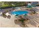 Aerial view of a community pool with lounge chairs at 3111 Bel Air Dr # 7D, Las Vegas, NV 89109