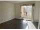 Bright living room featuring a sliding glass door to the outside and gray tile floors at 3119 Key Largo Dr # 204, Las Vegas, NV 89120