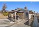 Backyard featuring a gazebo with a dining set, the home's exterior, and a view of the yard at 4136 Broadriver Dr, Las Vegas, NV 89108