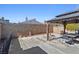 Backyard features a gazebo with a dining set, a block wall, and concrete pavers at 4136 Broadriver Dr, Las Vegas, NV 89108