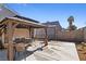 Backyard featuring a large gazebo with a dining set, and a view of the neighborhood landscaping at 4136 Broadriver Dr, Las Vegas, NV 89108