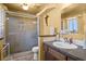 Bathroom featuring a glass-enclosed shower, vanity, and toilet at 4136 Broadriver Dr, Las Vegas, NV 89108