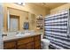 Bathroom with a large mirror, vanity, toilet, and shower/tub combo at 4136 Broadriver Dr, Las Vegas, NV 89108