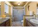 Bathroom featuring a glass-enclosed shower, vanity, and toilet at 4136 Broadriver Dr, Las Vegas, NV 89108