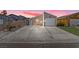 Charming single-story home with a long driveway, attached garage, and well-maintained front yard at 4136 Broadriver Dr, Las Vegas, NV 89108