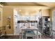 Modern kitchen featuring granite countertops, stainless steel appliances, and white cabinetry at 4136 Broadriver Dr, Las Vegas, NV 89108