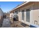 Back patio featuring a gas grill, concrete pavers, and access to the home through glass paneled doors at 4136 Broadriver Dr, Las Vegas, NV 89108