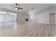 Spacious living room with modern ceiling fans, recessed lighting, and wood flooring at 5119 Vista Del Rancho Way, North Las Vegas, NV 89031